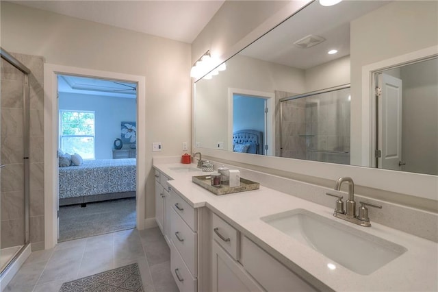 24110 W 95th St, Lenexa, KS 66227 - bathroom with connected bathroom, a shower stall, double vanity, tile patterned floors, and recessed lighting