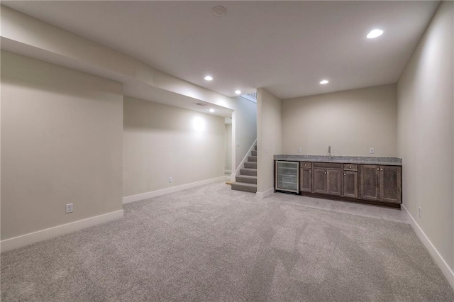 24110 W 95th St, Lenexa, KS 66227 - finished basement with bar area, beverage cooler, light colored carpet, stairs, and recessed lighting