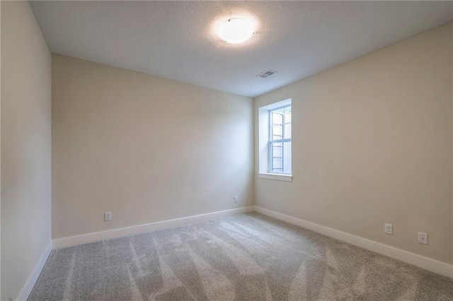 24110 W 95th St, Lenexa, KS 66227 - carpeted spare room featuring baseboards and a textured ceiling