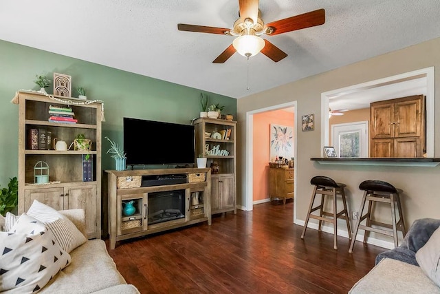 709 S 9th St, Louisburg, KS 66053 - living room with ceiling fan, wood finished floors, and a textured ceiling