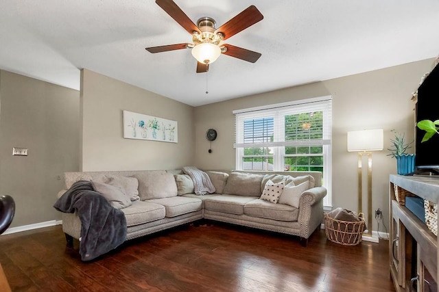 709 S 9th St, Louisburg, KS 66053 - living room with dark wood-type flooring, a ceiling fan, and a fireplace