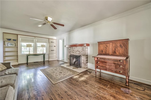 11 W 70th St, Kansas City, MO 64113 - living area featuring crown molding, a ceiling fan, hardwood / wood-style flooring, and a fireplace