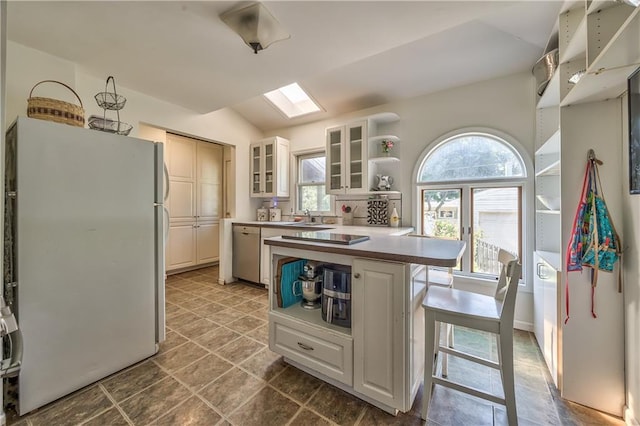 11 W 70th St, Kansas City, MO 64113 - kitchen featuring freestanding refrigerator, dishwasher, glass insert cabinets, lofted ceiling, and open shelves