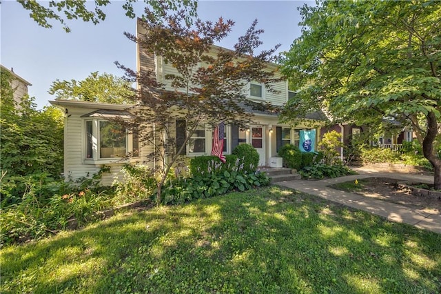 11 W 70th St, Kansas City, MO 64113 - view of property hidden behind natural elements featuring a front lawn