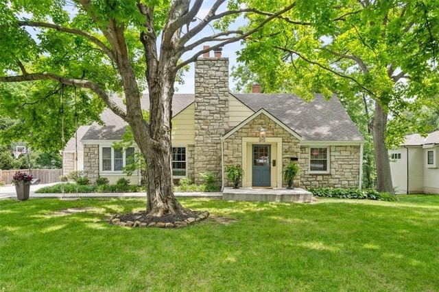 8315 Lee Blvd, Leawood, KS 66206 - view of front of property featuring stone siding, a chimney, and a shingled roof