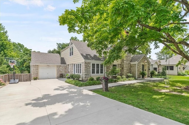 8315 Lee Blvd, Leawood, KS 66206 - view of front of property featuring stone siding, concrete driveway, and an attached garage