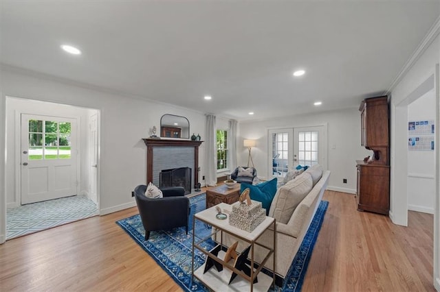 8315 Lee Blvd, Leawood, KS 66206 - living area with light wood-style floors, a fireplace, recessed lighting, and ornamental molding