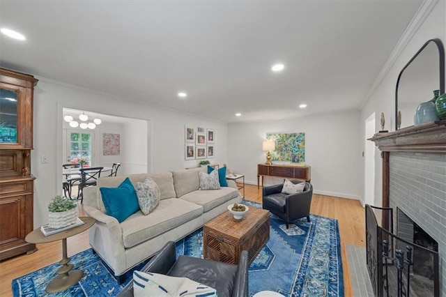 8315 Lee Blvd, Leawood, KS 66206 - living area with a fireplace, crown molding, light wood-type flooring, and recessed lighting