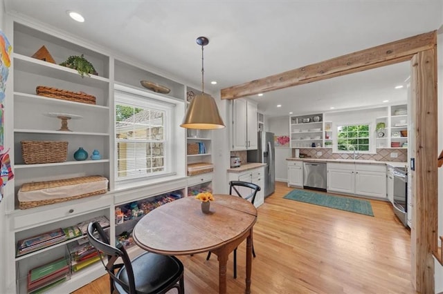 8315 Lee Blvd, Leawood, KS 66206 - dining space with light wood-style flooring, recessed lighting, and beam ceiling