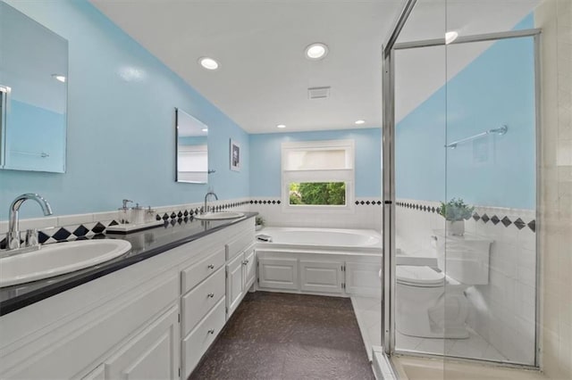 8315 Lee Blvd, Leawood, KS 66206 - bathroom featuring double vanity, a shower stall, a garden tub, and recessed lighting