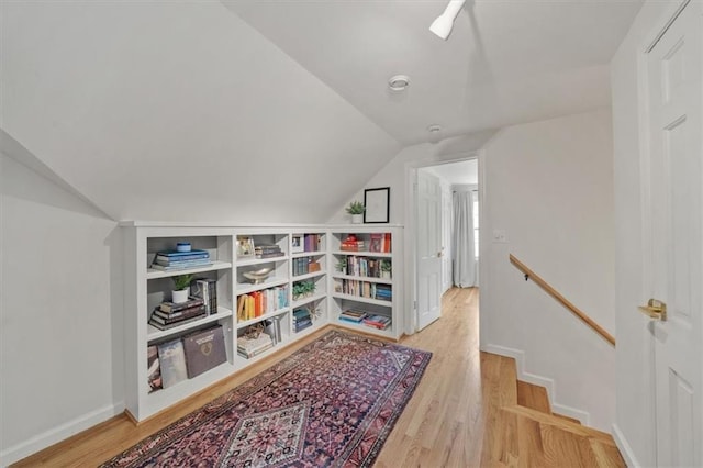 8315 Lee Blvd, Leawood, KS 66206 - living area with vaulted ceiling, wood finished floors, and an upstairs landing