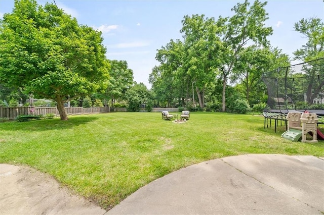 8315 Lee Blvd, Leawood, KS 66206 - view of yard featuring a trampoline