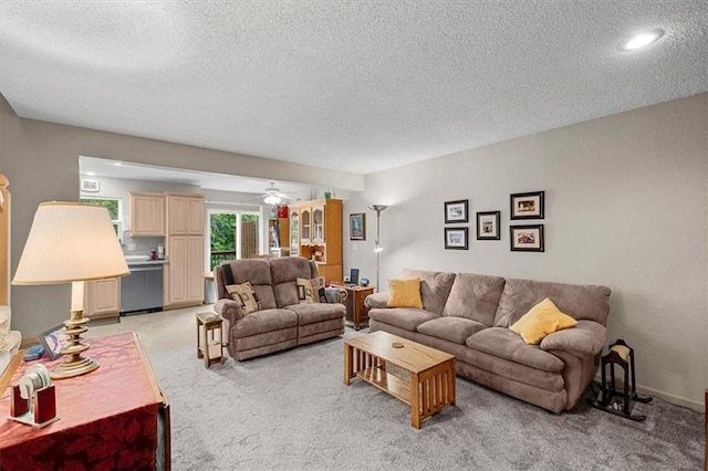 3568 NE Austin Dr, Lees Summit, MO 64064 - living area featuring light carpet, a textured ceiling, and a ceiling fan