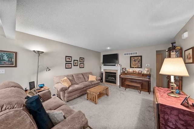 3568 NE Austin Dr, Lees Summit, MO 64064 - living area with a textured ceiling, light carpet, and a fireplace with flush hearth