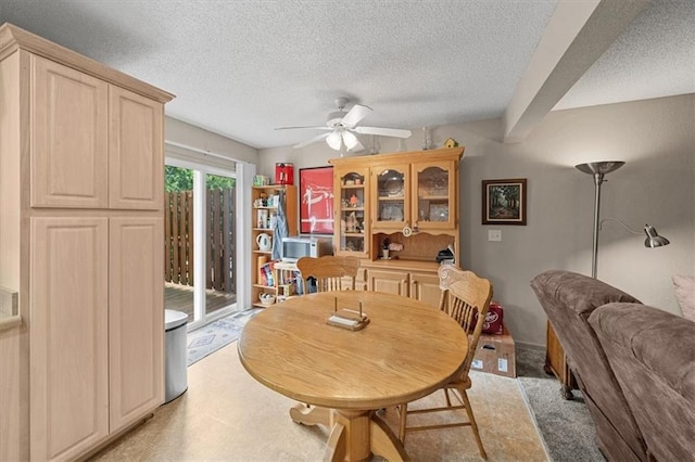 3568 NE Austin Dr, Lees Summit, MO 64064 - dining room featuring ceiling fan and a textured ceiling