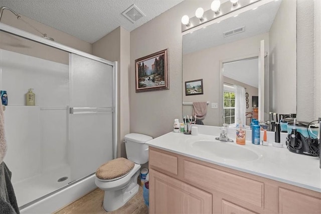 3568 NE Austin Dr, Lees Summit, MO 64064 - bathroom featuring a stall shower, vanity, and a textured ceiling