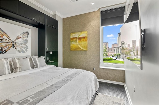4545 Wornall Rd Unit Le4, Kansas City, MO 64111 - bedroom with a city view, ornamental molding, wood finished floors, and recessed lighting