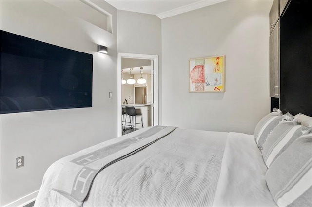 4545 Wornall Rd Unit Le4, Kansas City, MO 64111 - bedroom featuring crown molding