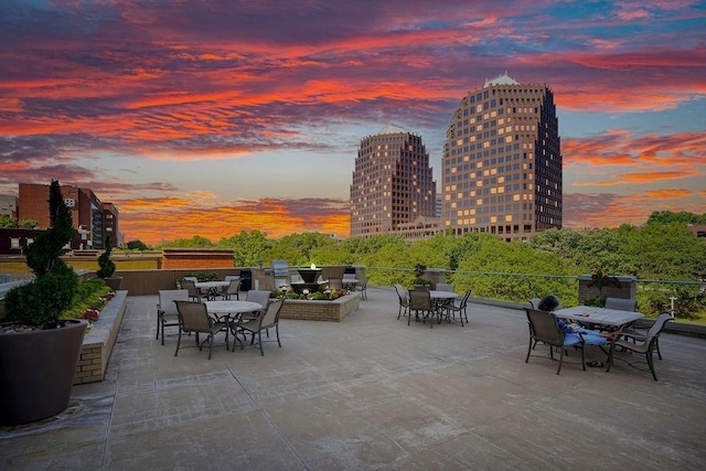 4545 Wornall Rd Unit Le4, Kansas City, MO 64111 - view of patio / terrace featuring outdoor dining space and a city view