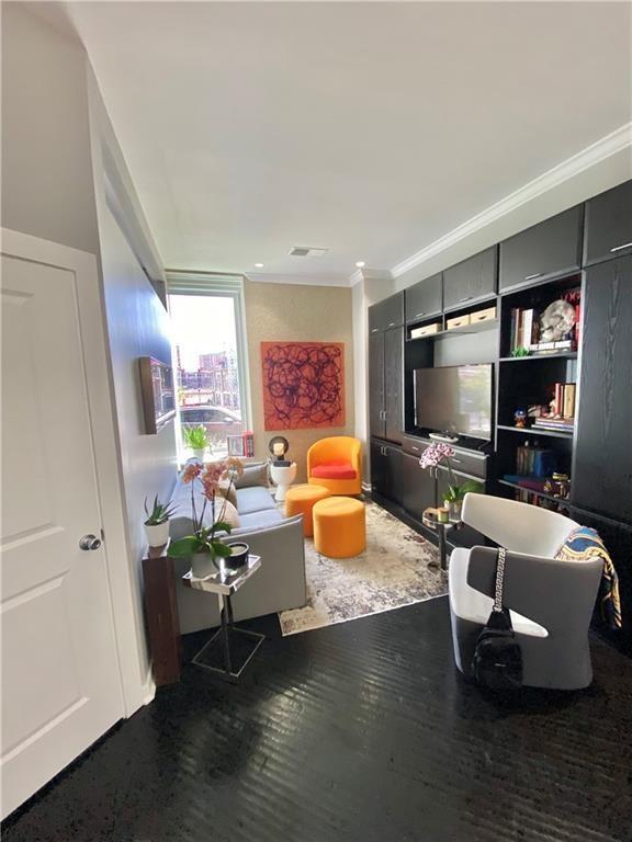 4545 Wornall Rd Unit Le4, Kansas City, MO 64111 - living area with wood finished floors and crown molding
