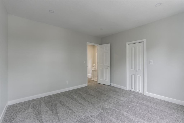 410 Kensington Ave, Kansas City, MO 64124 - unfurnished bedroom featuring carpet floors and a closet