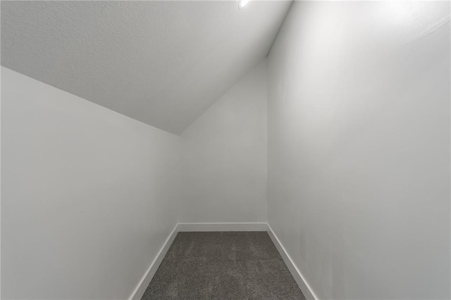 410 Kensington Ave, Kansas City, MO 64124 - bonus room with dark colored carpet and vaulted ceiling