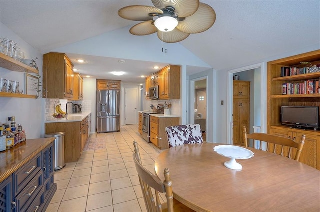 11325 W 54th St, Shawnee, KS 66203 - dining room with vaulted ceiling, light tile patterned floors, and a ceiling fan