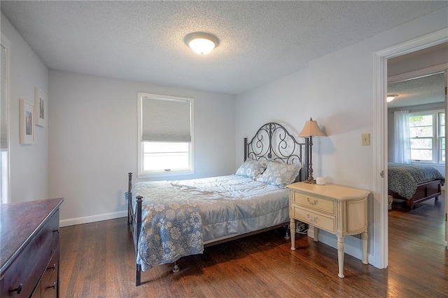 11325 W 54th St, Shawnee, KS 66203 - bedroom featuring dark wood-type flooring and a textured ceiling