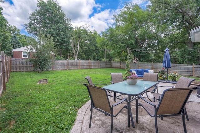 11325 W 54th St, Shawnee, KS 66203 - fenced backyard featuring outdoor dining space and a patio