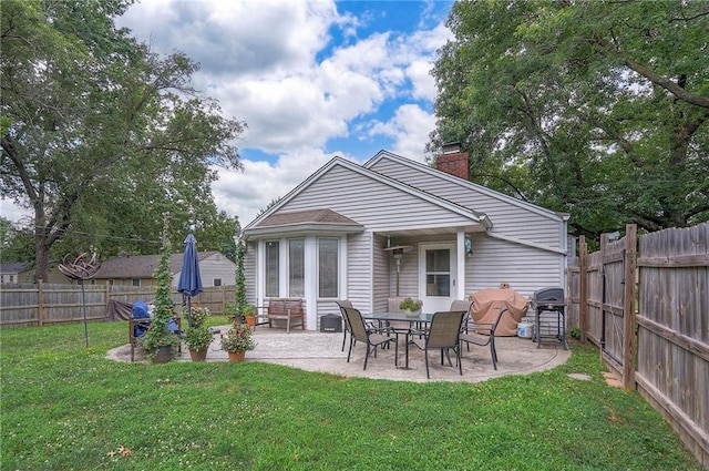 11325 W 54th St, Shawnee, KS 66203 - back of house with a chimney, a patio area, and a fenced backyard