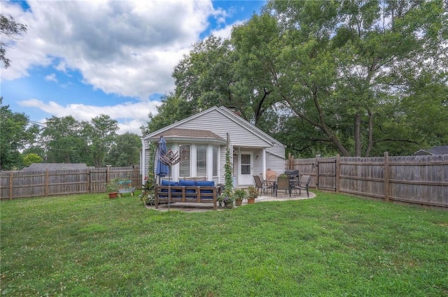 11325 W 54th St, Shawnee, KS 66203 - rear view of property featuring a patio, outdoor lounge area, and a fenced backyard
