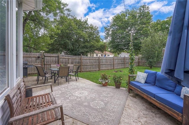 11325 W 54th St, Shawnee, KS 66203 - fenced backyard with an outdoor living space, a patio area, area for grilling, and outdoor dining area