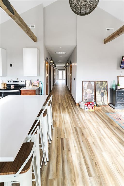 501 NW 101st Rd, Warrensburg, MO 64093 - hallway featuring a high ceiling and light wood-type flooring