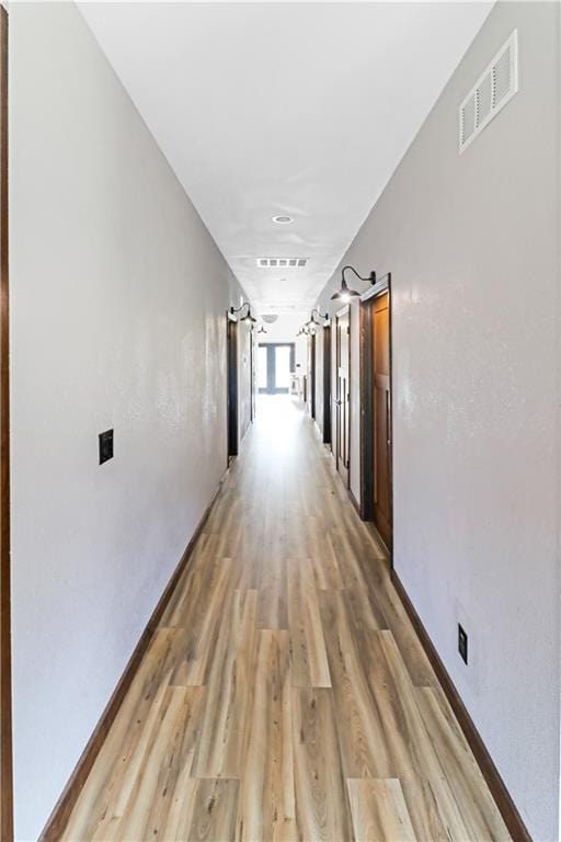 501 NW 101st Rd, Warrensburg, MO 64093 - corridor with light wood-style flooring and baseboards