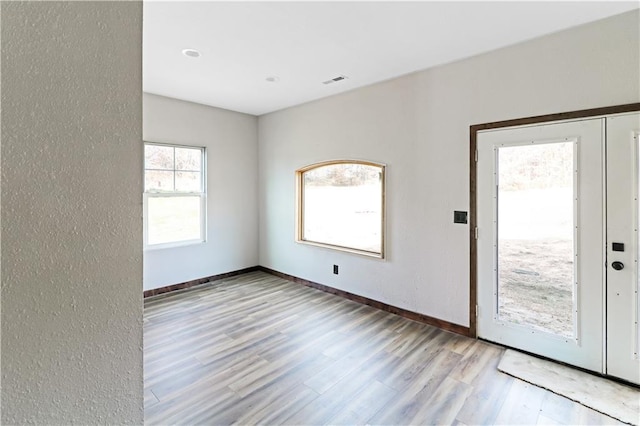 501 NW 101st Rd, Warrensburg, MO 64093 - spare room with wood finished floors and a textured wall