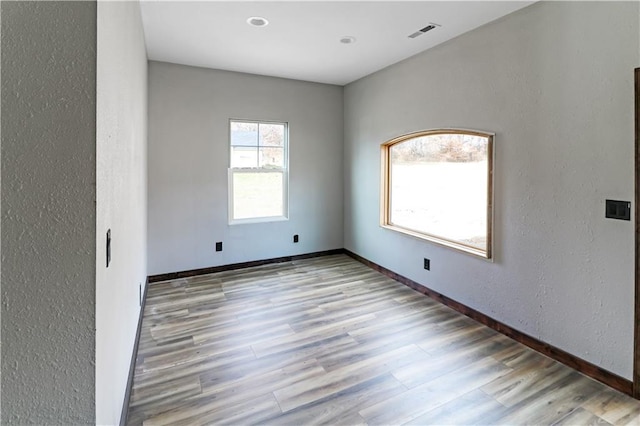 501 NW 101st Rd, Warrensburg, MO 64093 - spare room with a textured wall and wood finished floors