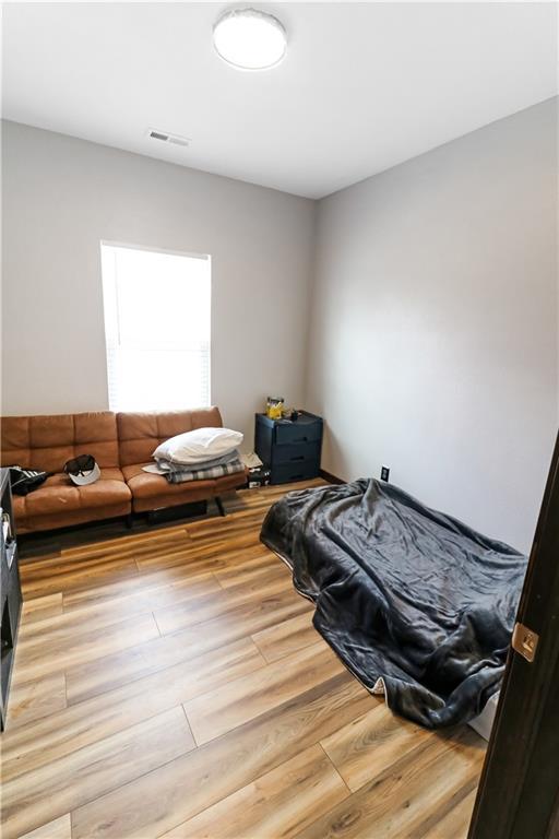 501 NW 101st Rd, Warrensburg, MO 64093 - bedroom featuring wood finished floors