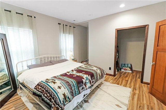 501 NW 101st Rd, Warrensburg, MO 64093 - bedroom featuring light wood finished floors and baseboards