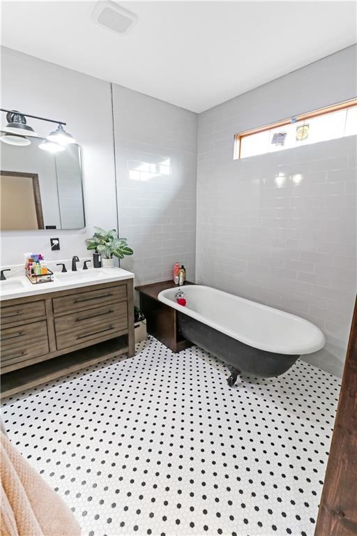 501 NW 101st Rd, Warrensburg, MO 64093 - full bath featuring double vanity and a freestanding tub