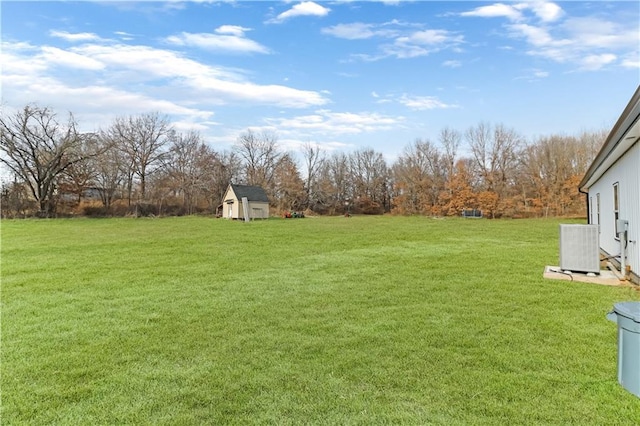 501 NW 101st Rd, Warrensburg, MO 64093 - view of grassy yard featuring a storage shed and view of scattered trees