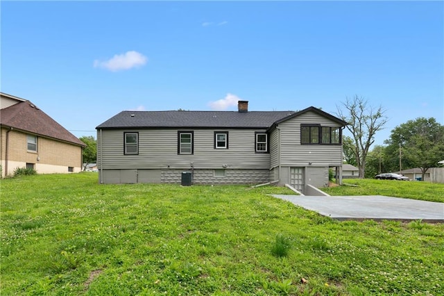 6806 N Brookside Rd, Pleasant Valley, MO 64068 - rear view of property featuring a chimney, a yard, and a patio area
