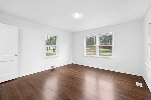 6806 N Brookside Rd, Pleasant Valley, MO 64068 - empty room featuring dark wood-style flooring and baseboards