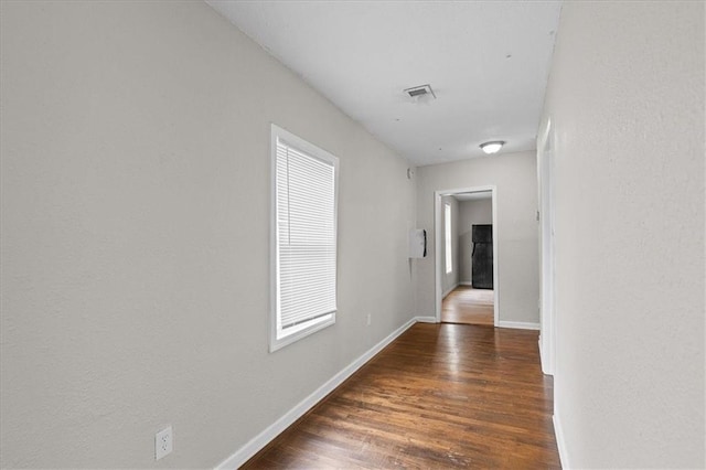 1646 Bennington Ave, Kansas City, MO 64126 - corridor featuring wood finished floors and baseboards
