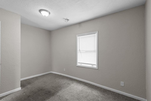 1646 Bennington Ave, Kansas City, MO 64126 - carpeted spare room with a textured wall and a textured ceiling