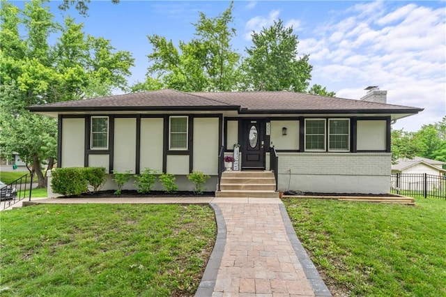 3005 Elmira Ct, Independence, MO 64057 - view of front of home with a chimney, brick siding, stucco siding, and a shingled roof