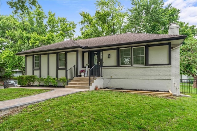 3005 Elmira Ct, Independence, MO 64057 - view of front of property with a chimney and brick siding