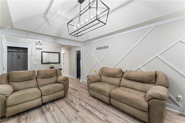 3005 Elmira Ct, Independence, MO 64057 - living area with light wood-type flooring and a chandelier