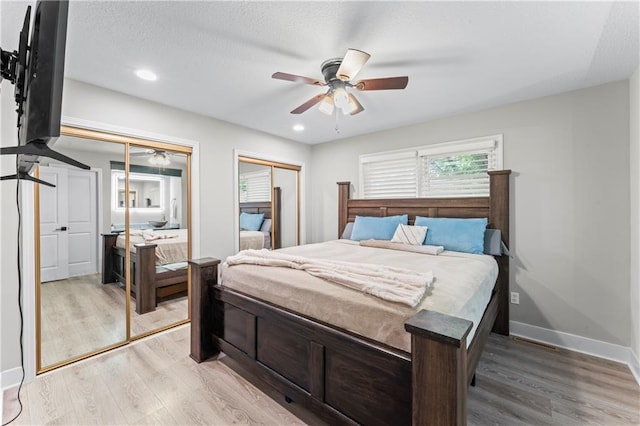 3005 Elmira Ct, Independence, MO 64057 - bedroom featuring multiple closets, light wood-style flooring, ceiling fan, and recessed lighting