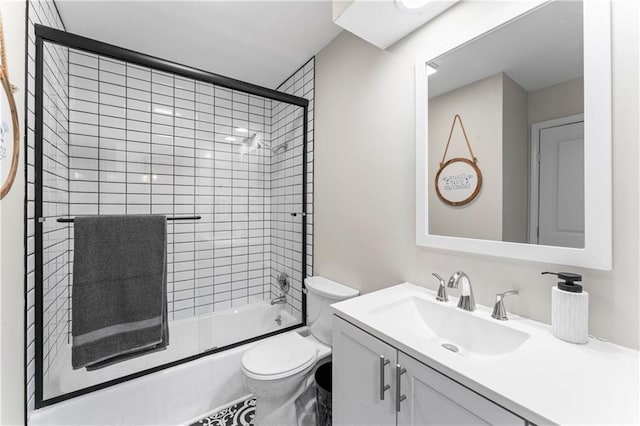 3005 Elmira Ct, Independence, MO 64057 - bathroom featuring vanity and bath / shower combo with glass door