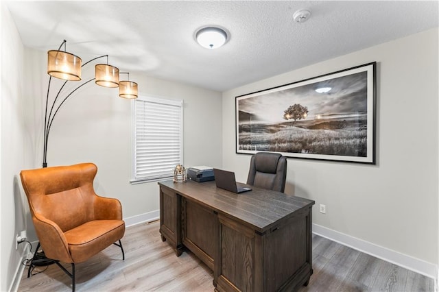 3005 Elmira Ct, Independence, MO 64057 - home office featuring light wood finished floors and a textured ceiling